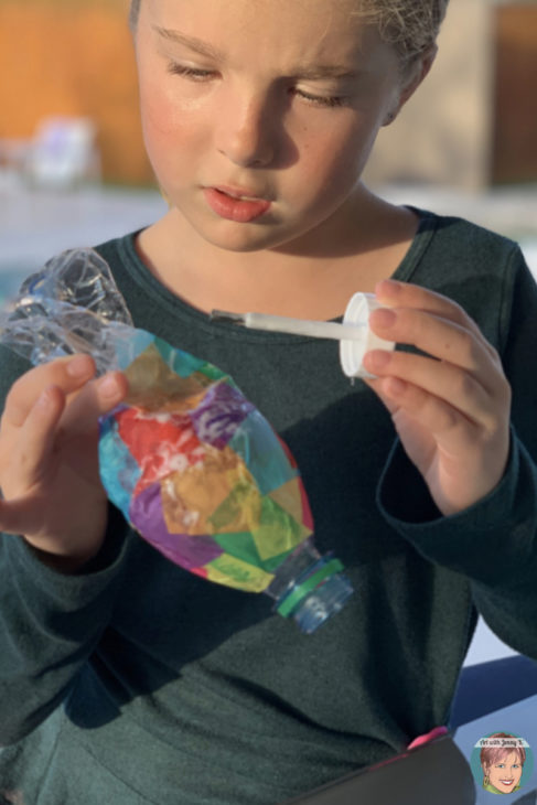 Water bottle rainbow fish - an inexpensive and easy activity for Earth Day.